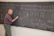 A professor conducts a lecture for his "Nonlinear Dynamics and Chaos" class.