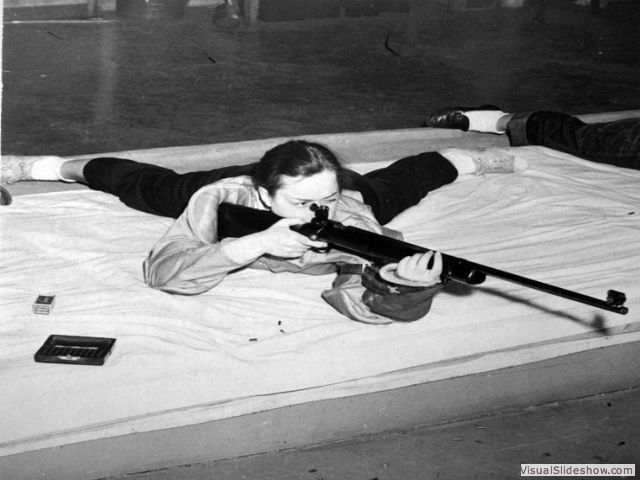 Rifle practice, circa 1950<br/>Despite having heavy courseloads, students still found time to pursue extracirricular activites. The Rifle Club in the lower level of the Women's Athletic Building by Mosher-Jordan was especially popular.