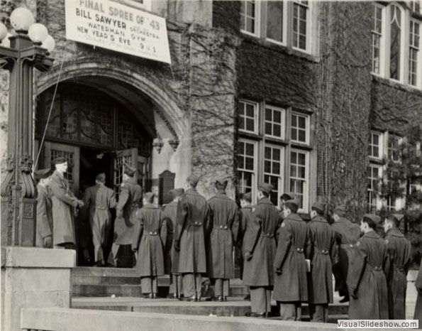 Company B-4 entering the Union at chow time, 1943<br/>Despite many advancements around campus, women still could not enter through the front door of the Michigan Union except on football Saturdays.