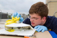 A team member works on elements and details for the latest design of the U-M Solar Car.