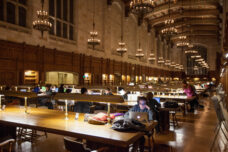 A student studies into the next day in the Law School Reading Room.