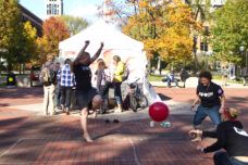 Students play a game of four square on the Diag.