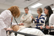 Medical students work with instructors in the Clinical Simulation Lab at the U-M Health System.