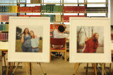 A student studies near the "My Right Self" exhibit in the Taubman Health Services Library.