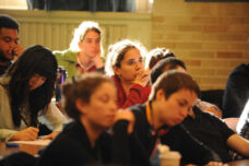 A law school student listens intently during an international law workshop in Hutchins Hall.