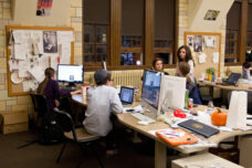 Students prep the next day's issue of the Michigan Daily newspaper at the Student Publications Building.