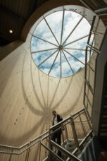 A professor walks past the sundial inside the Phoenix Memorial Lab.