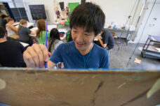 A student works on an art piece during the Stamps School of Art & Design's "Portfolio Prep" program.