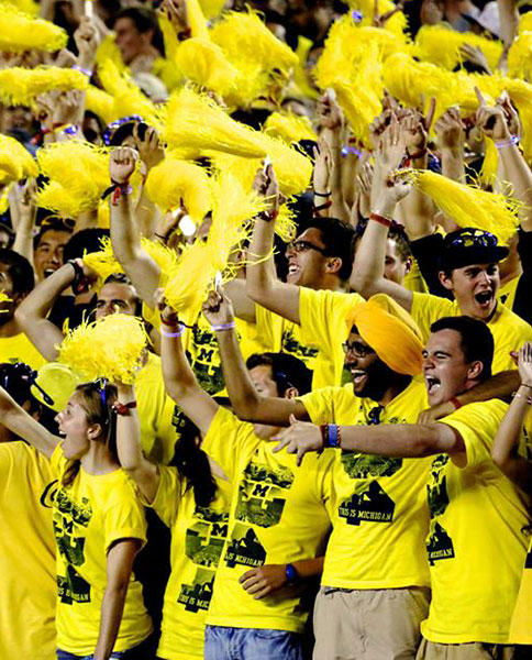 U-M fans enjoy a football game "under the lights" at Michigan Stadium